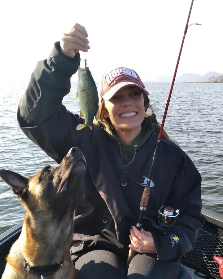 Fishing with her pup